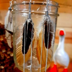Dangle feather and chain earrings
